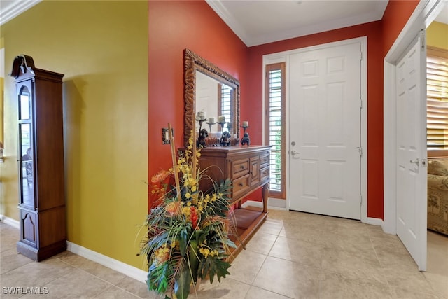 16580 Goldenrod Ln Unit 103, Alva, FL 33920 - entrance foyer featuring plenty of natural light, crown molding, baseboards, and light tile patterned flooring