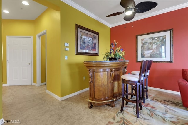 16580 Goldenrod Ln Unit 103, Alva, FL 33920 - bar with crown molding, tile patterned flooring, baseboards, ceiling fan, and recessed lighting