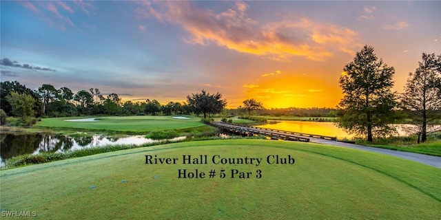 16580 Goldenrod Ln Unit 103, Alva, FL 33920 - view of property's community with a lawn and a water view
