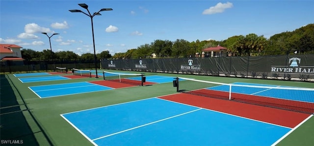 16580 Goldenrod Ln Unit 103, Alva, FL 33920 - view of tennis court with community basketball court and fence
