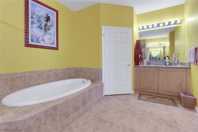 16580 Goldenrod Ln Unit 103, Alva, FL 33920 - full bathroom with vanity, a bath, and tile patterned flooring
