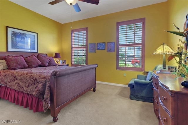16580 Goldenrod Ln Unit 103, Alva, FL 33920 - bedroom with light carpet, baseboards, and ceiling fan