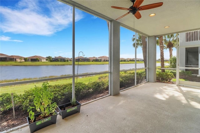 16580 Goldenrod Ln Unit 103, Alva, FL 33920 - unfurnished sunroom with a water view and a ceiling fan