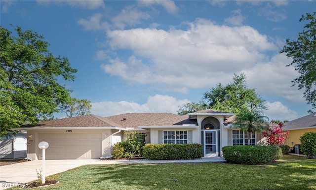 795 Charlemagne Blvd, Naples, FL 34112 - view of front of home featuring a front yard, a garage, concrete driveway, stucco siding, and roof with shingles