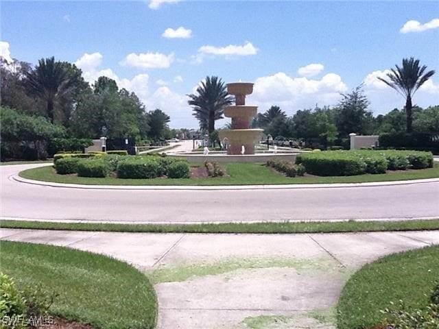 11735 Eros Rd, Lehigh Acres, FL 33971 - view of road with sidewalks