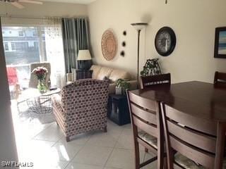 11735 Eros Rd, Lehigh Acres, FL 33971 - dining space featuring a ceiling fan and light tile patterned flooring