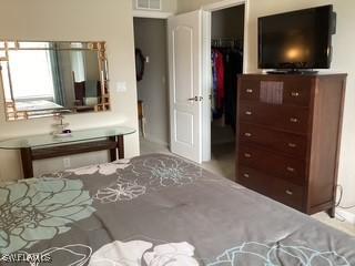 11735 Eros Rd, Lehigh Acres, FL 33971 - bedroom with visible vents and a walk in closet