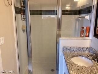 11735 Eros Rd, Lehigh Acres, FL 33971 - full bathroom featuring a shower stall and vanity