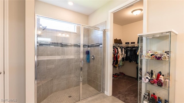 1410 SW 38th St, Cape Coral, FL 33914 - full bathroom featuring a stall shower, tile patterned floors, and a walk in closet