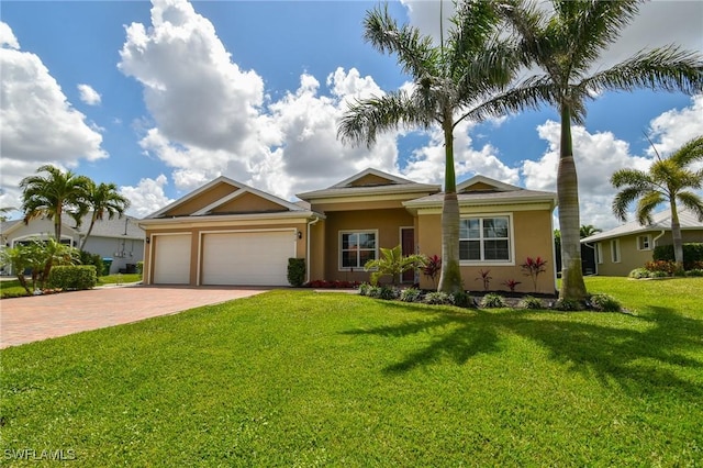 1410 SW 38th St, Cape Coral, FL 33914 - ranch-style home with decorative driveway, stucco siding, a garage, and a front lawn