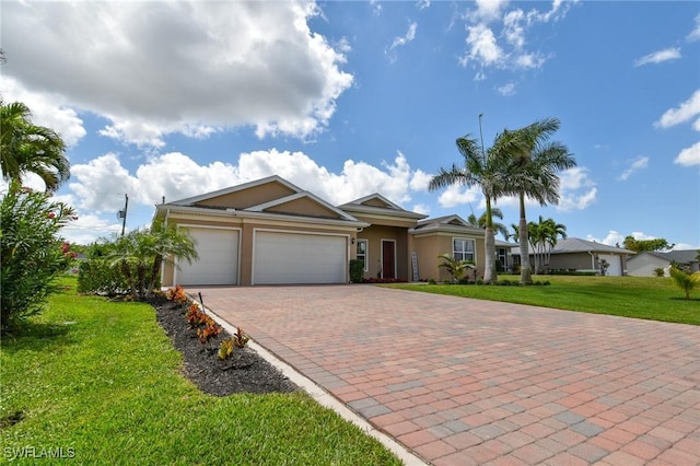1410 SW 38th St, Cape Coral, FL 33914 - ranch-style home featuring stucco siding, decorative driveway, a garage, and a front yard