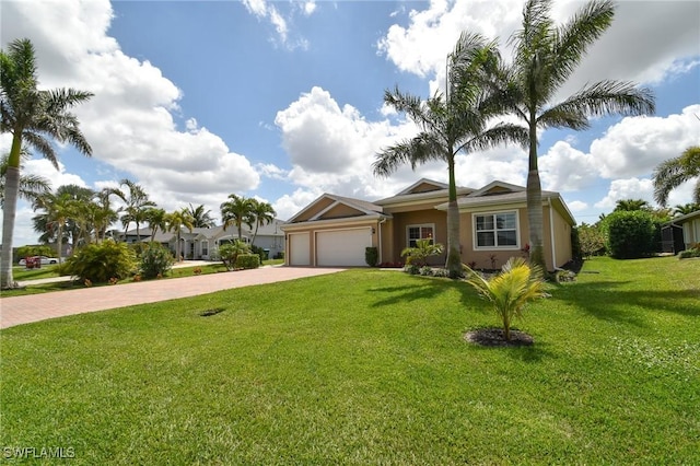 1410 SW 38th St, Cape Coral, FL 33914 - view of front facade featuring driveway, an attached garage, stucco siding, and a front yard