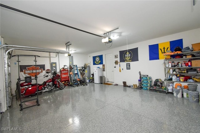 1410 SW 38th St, Cape Coral, FL 33914 - garage with a garage door opener and freestanding refrigerator