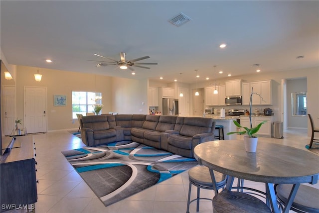 1410 SW 38th St, Cape Coral, FL 33914 - living area with light tile patterned floors, a ceiling fan, baseboards, and recessed lighting
