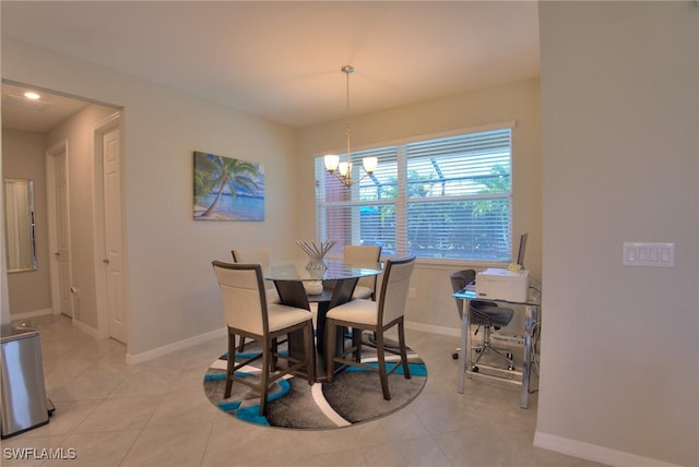 1410 SW 38th St, Cape Coral, FL 33914 - dining room with a chandelier, baseboards, and light tile patterned floors