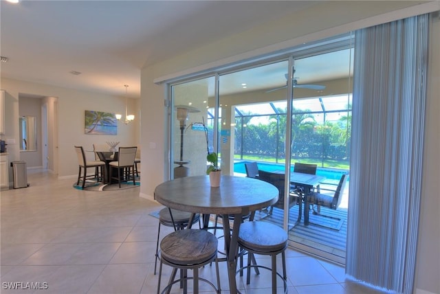 1410 SW 38th St, Cape Coral, FL 33914 - dining space featuring ceiling fan, light tile patterned floors, and baseboards