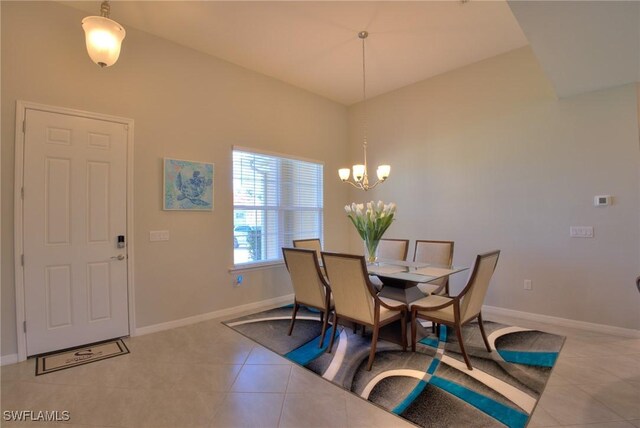 1410 SW 38th St, Cape Coral, FL 33914 - dining area featuring light tile patterned floors, a chandelier, and baseboards