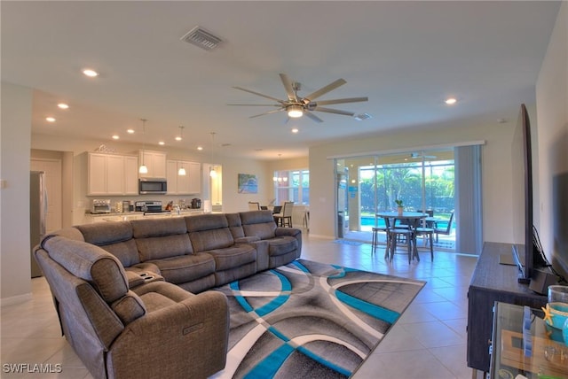1410 SW 38th St, Cape Coral, FL 33914 - living room with recessed lighting, light tile patterned floors, a ceiling fan, and baseboards