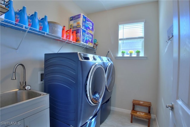 1410 SW 38th St, Cape Coral, FL 33914 - laundry room with washer and clothes dryer and baseboards