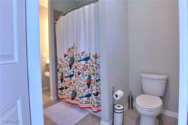 1410 SW 38th St, Cape Coral, FL 33914 - bathroom with toilet, tile patterned floors, and a shower with curtain