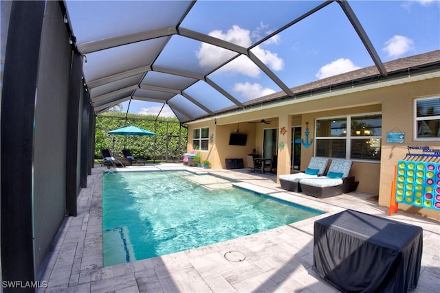 1410 SW 38th St, Cape Coral, FL 33914 - swimming pool featuring a patio, a ceiling fan, and glass enclosure