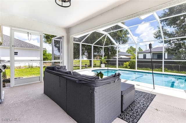 outdoor pool with a patio and a lanai