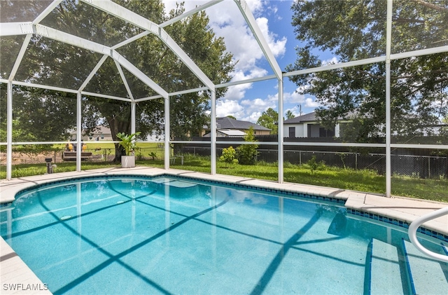 pool featuring glass enclosure and fence