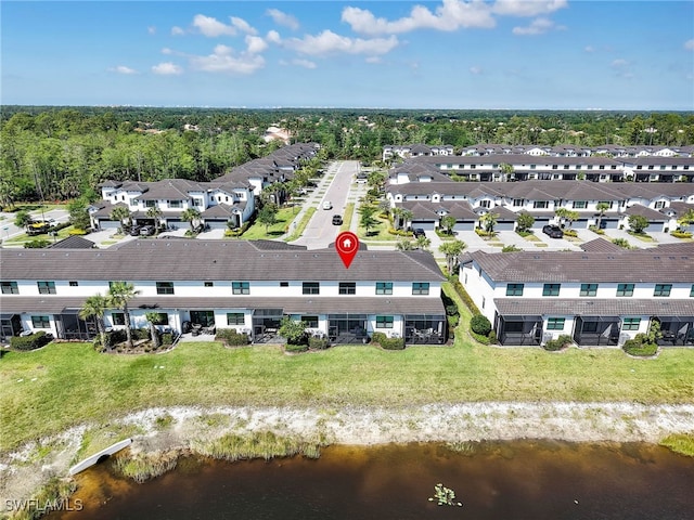 aerial view featuring a water view and a residential view