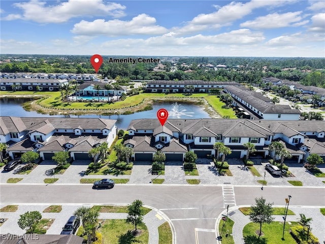 birds eye view of property featuring a residential view and a water view