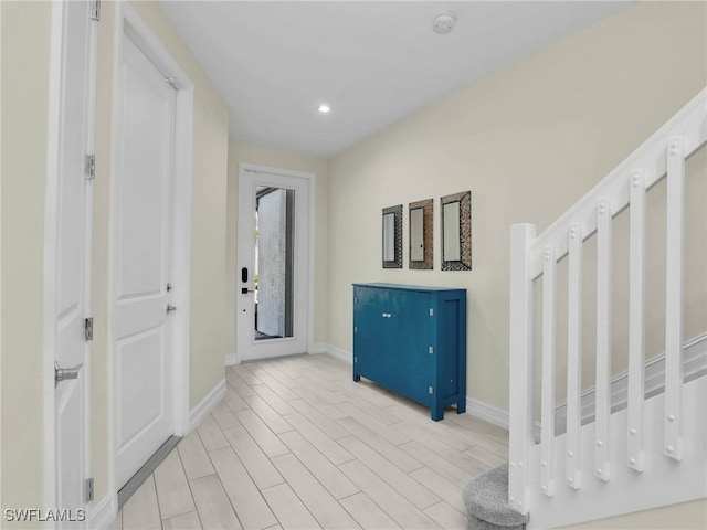 entrance foyer with recessed lighting and baseboards