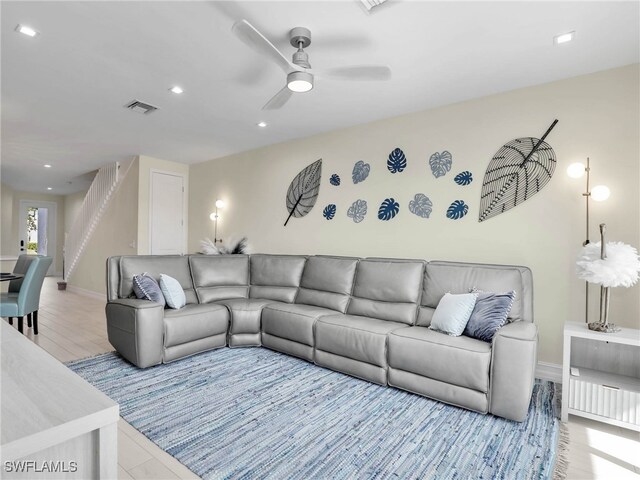 living room with baseboards, visible vents, ceiling fan, and recessed lighting