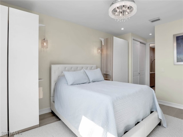 bedroom with visible vents, recessed lighting, a chandelier, and baseboards