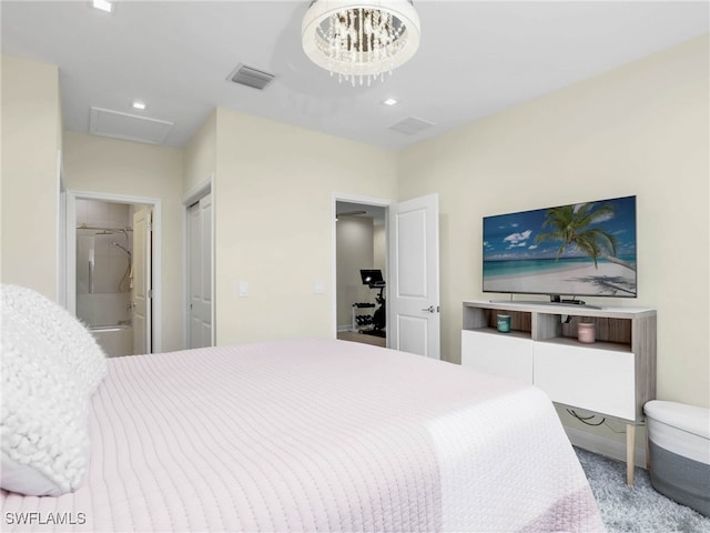 bedroom with attic access, visible vents, ensuite bathroom, and recessed lighting