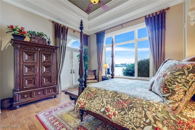 580 S Heathwood Dr, Marco Island, FL 34145 - bedroom with a ceiling fan, light wood-style flooring, crown molding, and a raised ceiling
