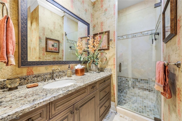 580 S Heathwood Dr, Marco Island, FL 34145 - bathroom featuring vanity, wallpapered walls, and a shower stall