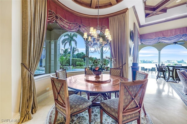 580 S Heathwood Dr, Marco Island, FL 34145 - dining space featuring an inviting chandelier, plenty of natural light, crown molding, and baseboards