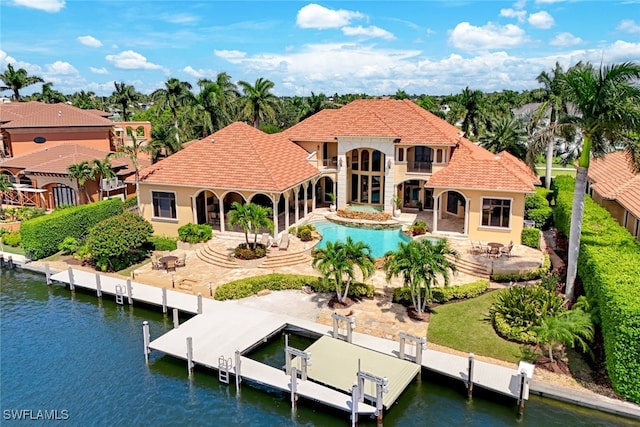 580 S Heathwood Dr, Marco Island, FL 34145 - back of property featuring a fenced backyard, boat lift, a water view, and a patio area