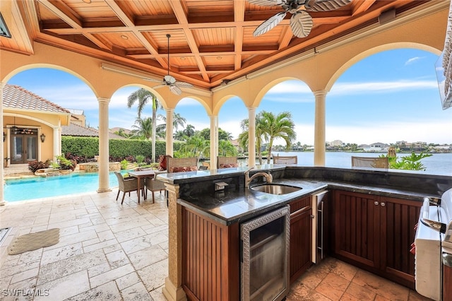 580 S Heathwood Dr, Marco Island, FL 34145 - view of patio / terrace with a fenced in pool, a sink, a ceiling fan, and beverage cooler