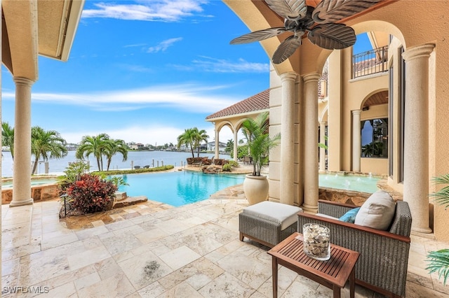 580 S Heathwood Dr, Marco Island, FL 34145 - pool featuring a ceiling fan, a water view, and a patio