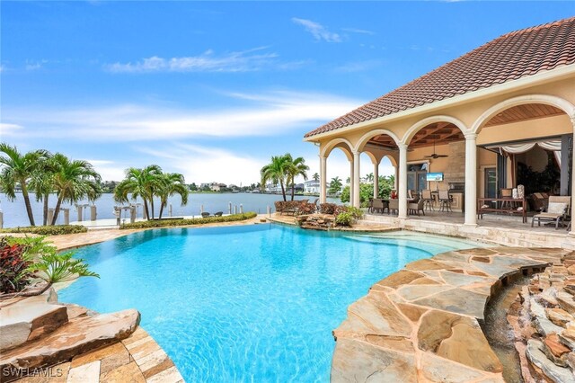 580 S Heathwood Dr, Marco Island, FL 34145 - pool featuring a water view, ceiling fan, and a patio