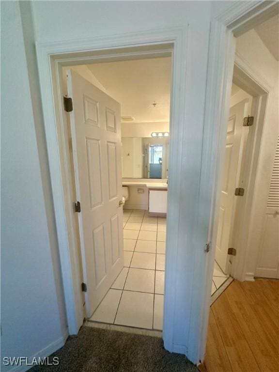 corridor featuring light wood-style flooring