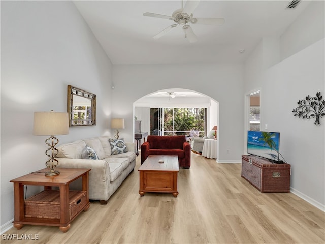 5774 Greenwood Cir Unit 64, Naples, FL 34112 - living room with a ceiling fan, light wood-type flooring, baseboards, visible vents, and arched walkways