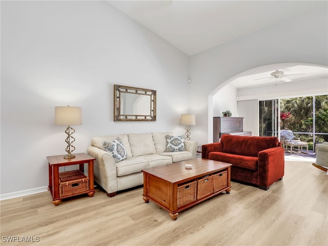 5774 Greenwood Cir Unit 64, Naples, FL 34112 - living area with arched walkways, ceiling fan, and light wood-style flooring