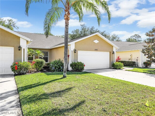 5774 Greenwood Cir Unit 64, Naples, FL 34112 - single story home featuring stucco siding, an attached garage, a front lawn, and concrete driveway