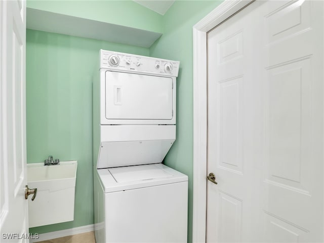 5774 Greenwood Cir Unit 64, Naples, FL 34112 - washroom with stacked washer / dryer and laundry area