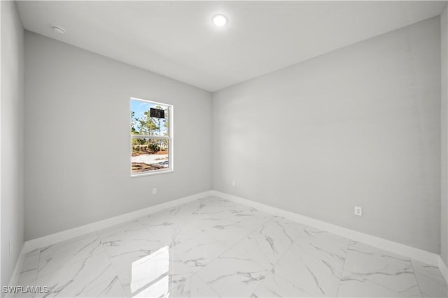 1034 Green Field St, Lehigh Acres, FL 33974 - spare room featuring baseboards and marble finish floors