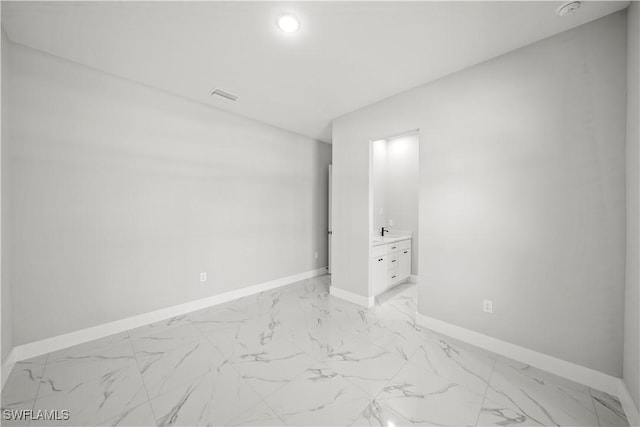 1034 Green Field St, Lehigh Acres, FL 33974 - empty room featuring light marble finish floors, baseboards, recessed lighting, and a smoke detector