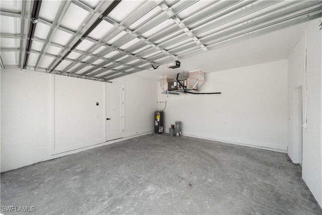 garage featuring a garage door opener and electric water heater