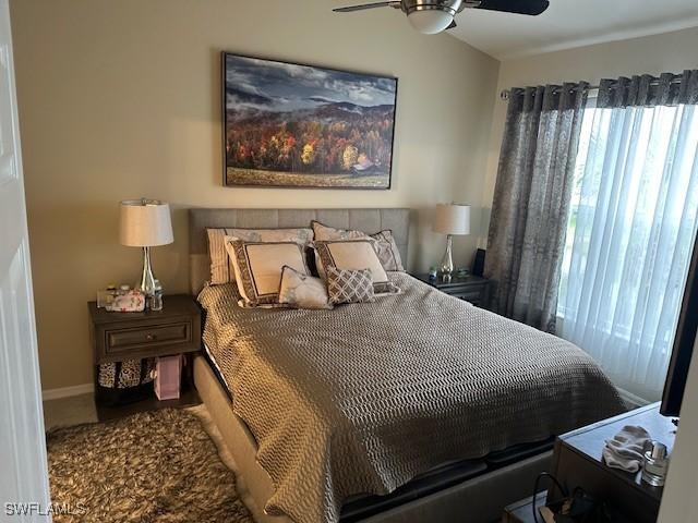 1280 Henley St Unit 1601, Naples, FL 34105 - bedroom featuring baseboards and a ceiling fan