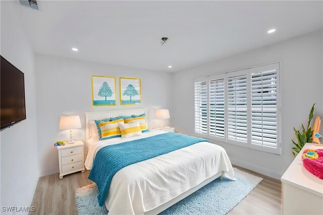 750 Southern Pines Dr, Naples, FL 34103 - bedroom with light wood-style flooring, baseboards, and recessed lighting